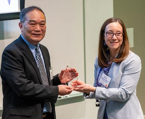 Dr. Wang accepts award